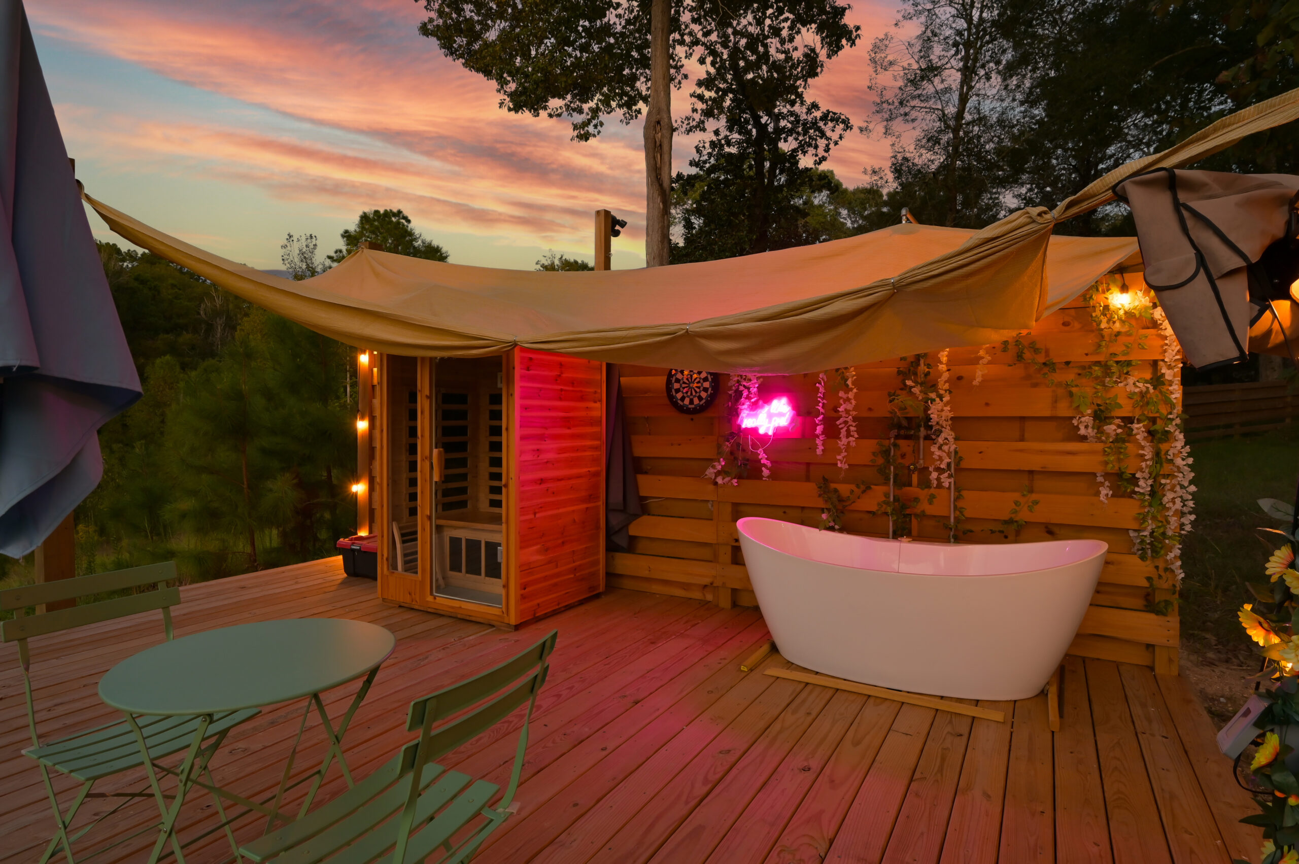 Luxury geo dome and mirrored glamping cabin surrounded by trees in Coldspring, TX